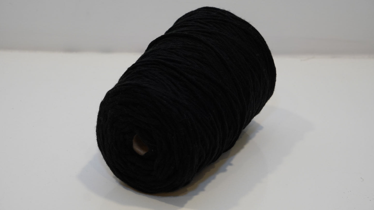Black tufting yarn single skein angled view