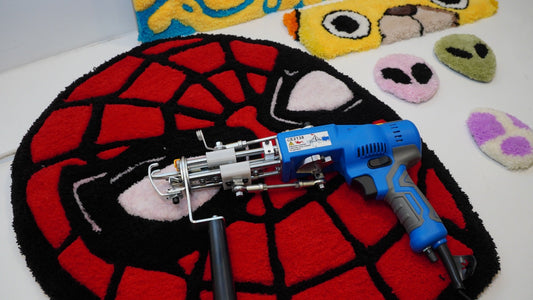 Blue AK-V Pro tufting gun displayed on a finished red rug