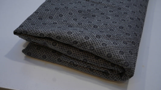Black non-slip backing cloth for tufted rugs, folded angle