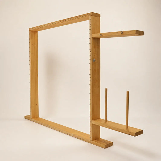 Adjustable wooden tufting frame with integrated yarn holder and thread guides