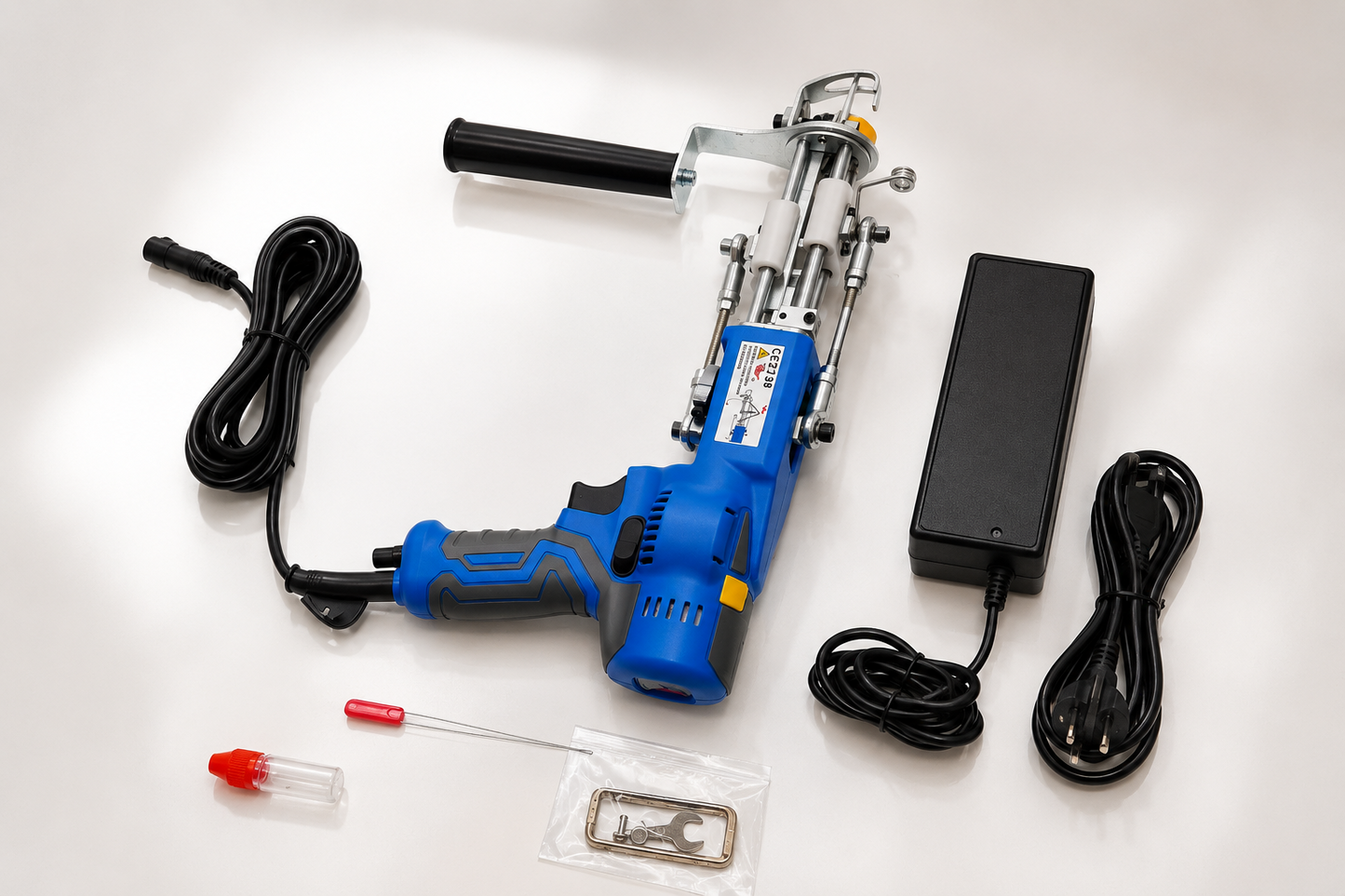Blue AK-V Pro tufting gun with power supply and included accessories