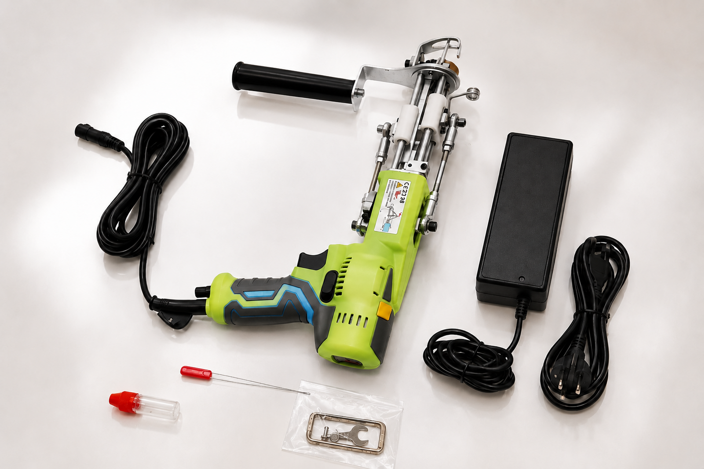 Green AK-V Pro tufting gun with power supply and included accessories