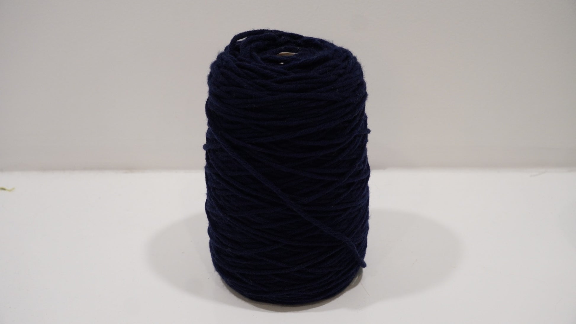 Deep navy tufting yarn single skein front view