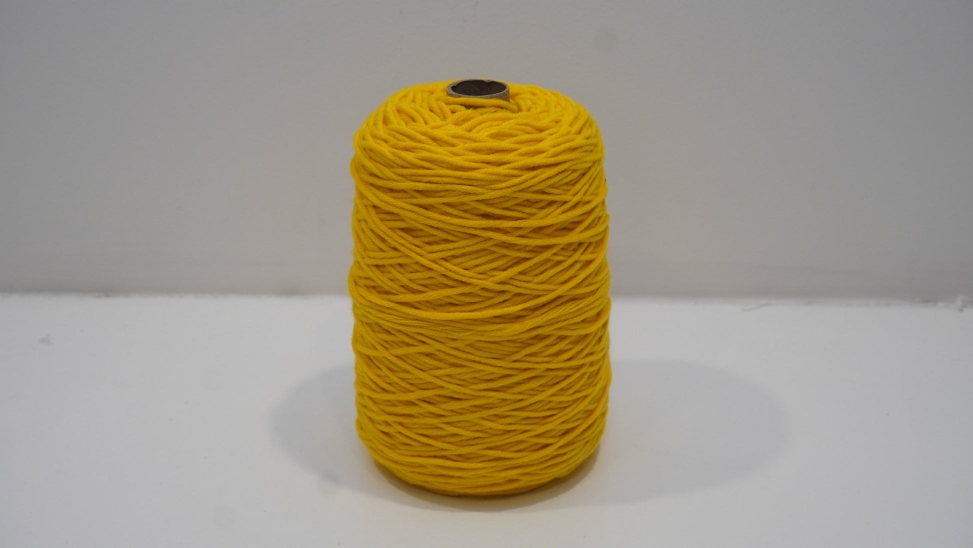 Golden yellow tufting yarn single skein detail view
