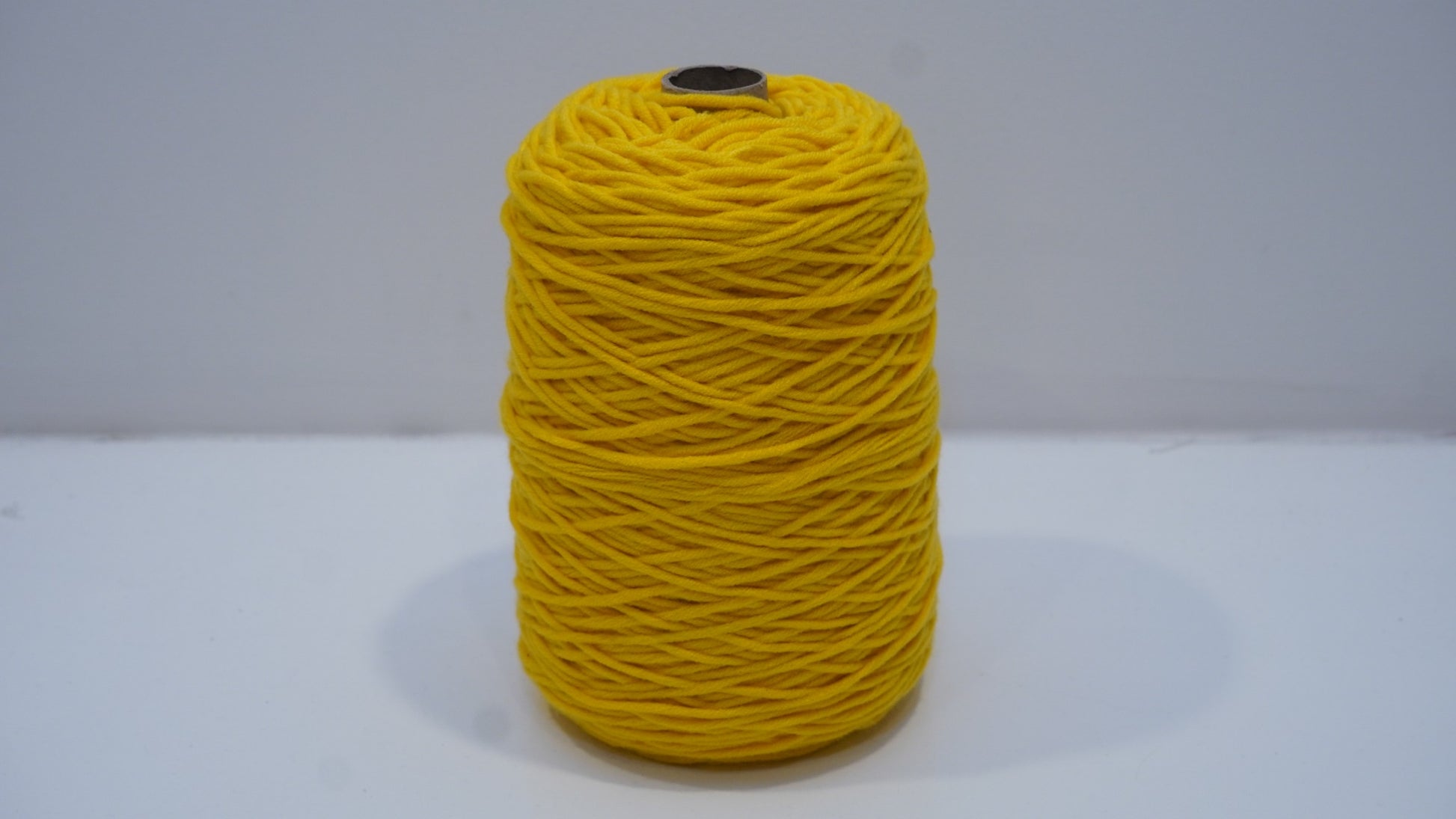 Golden yellow tufting yarn single skein front view