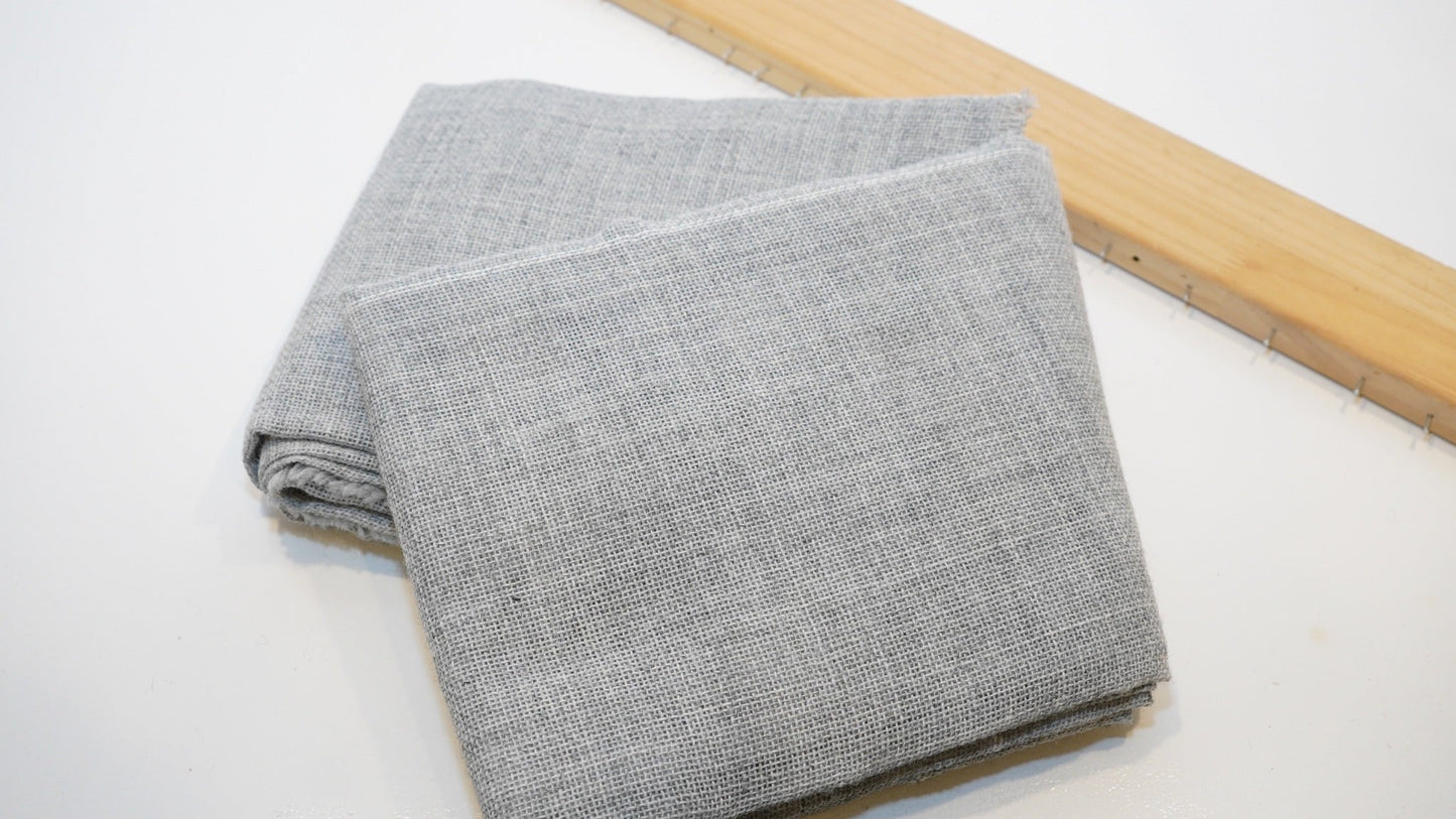 Folded grey premium tufting cloth for rug making