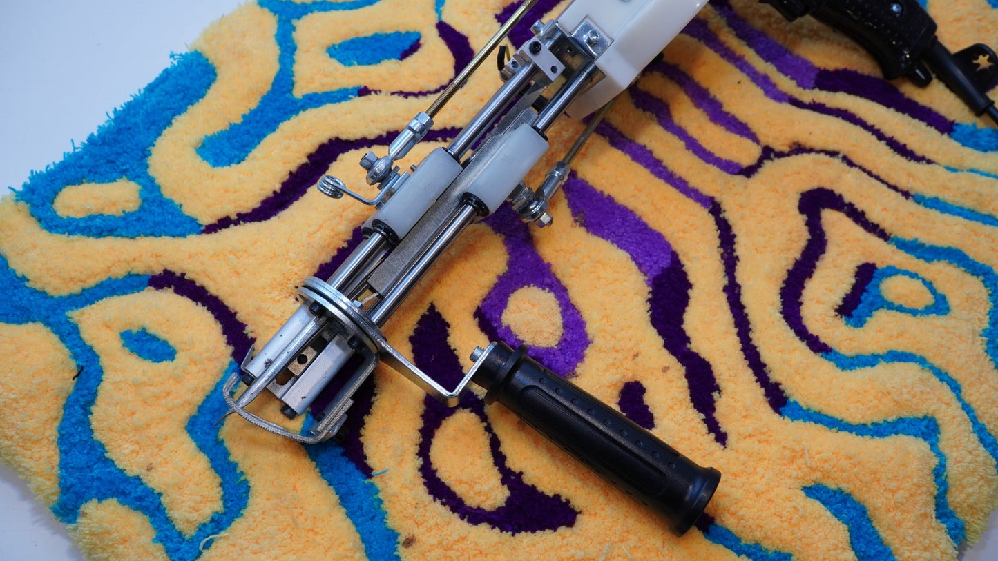 Close-up of the Long AK-V Pro tufting gun front mechanism and support handle