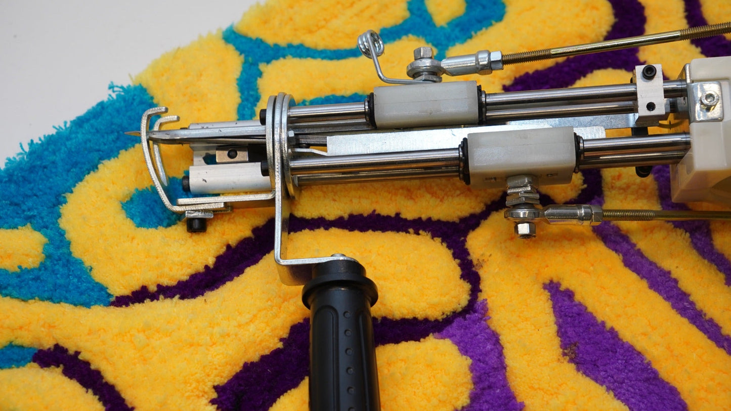 Close-up of the Long AK-V Pro tufting gun needle and drive assembly