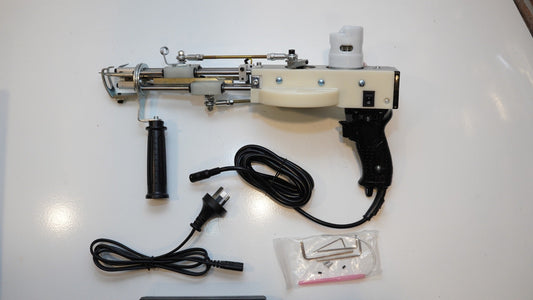 Long AK-V Pro tufting gun with power cable and included tools
