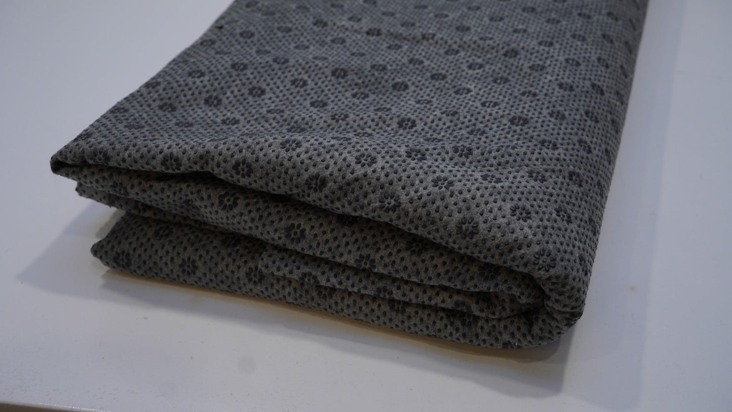 Black rug backing cloth, folded close-up