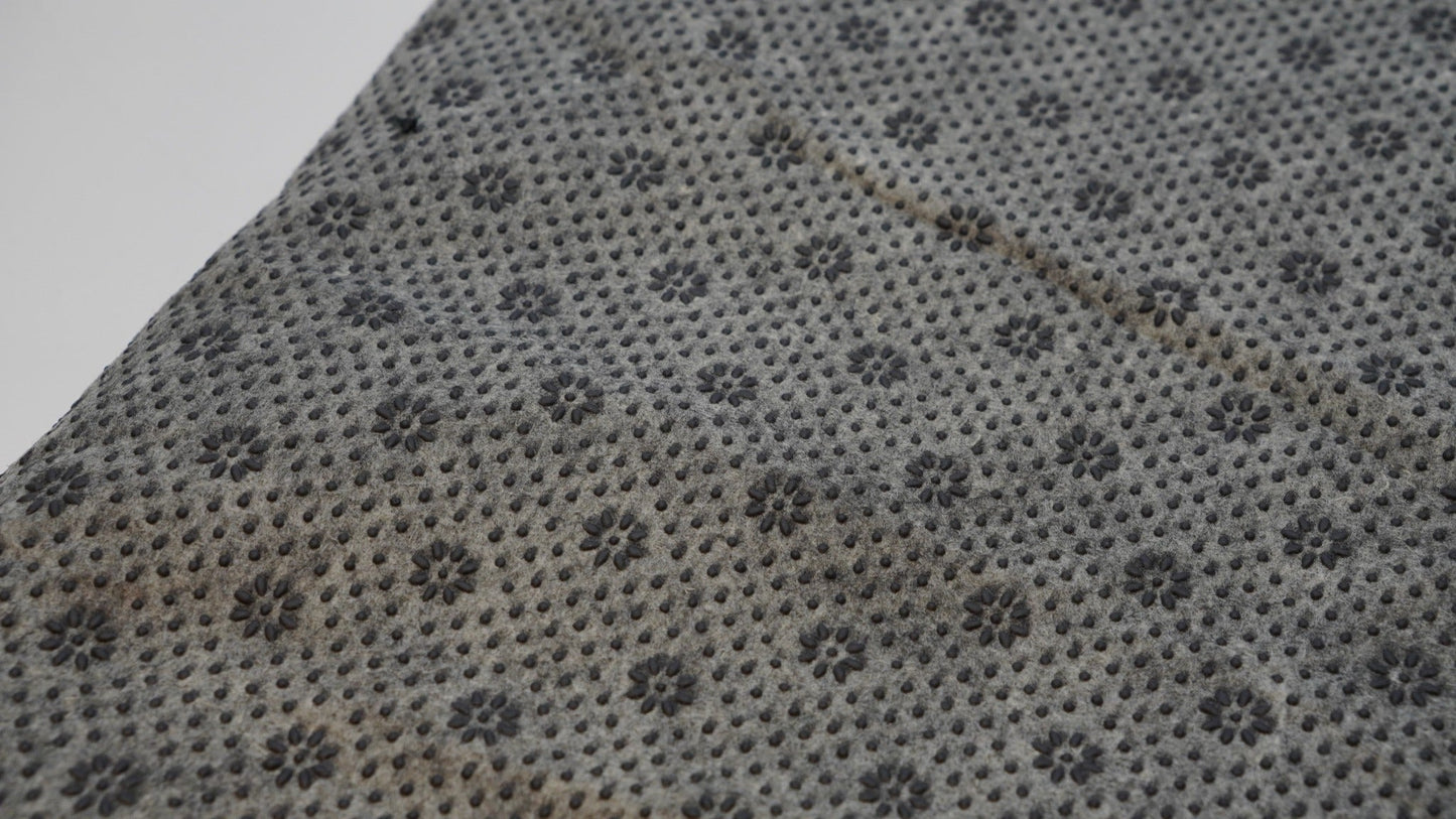Grey rug backing cloth with anti-slip grip pattern