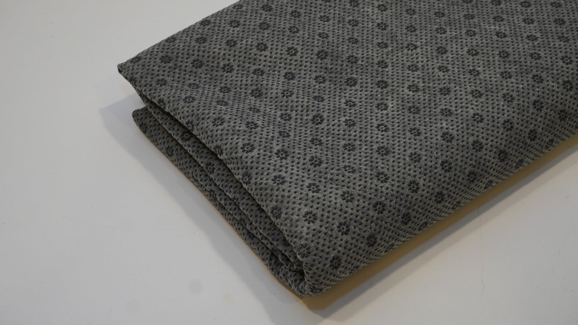 Grey non-slip rug backing cloth, folded product view
