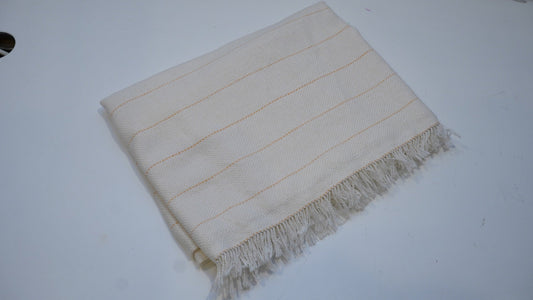 Folded primary tufting backing cloth with yellow guide lines