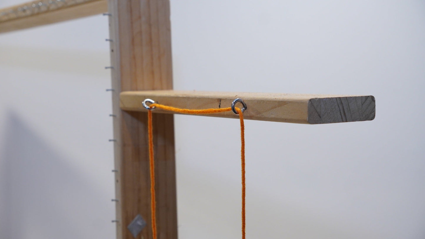 Upper thread guide eyelets on the adjustable wooden tufting frame