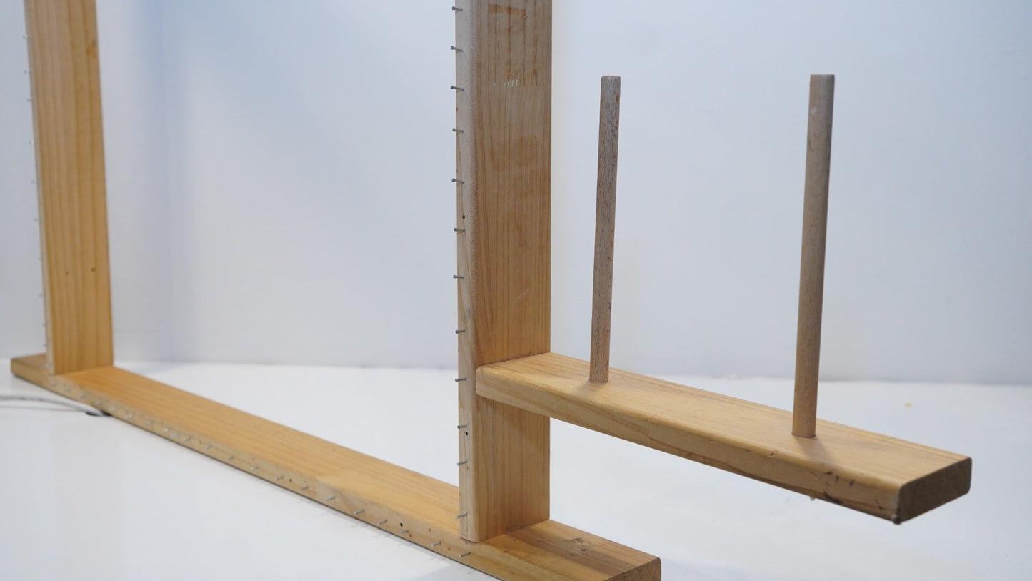 Integrated two-cone yarn holder on the adjustable wooden tufting frame